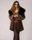 woman wearing brown coat long length
